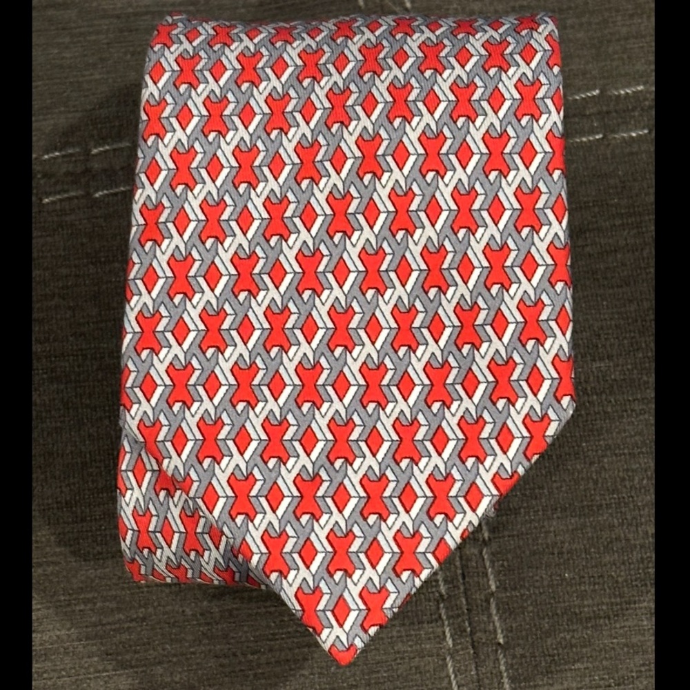 100% silk Hermes tie. Dry clean only.